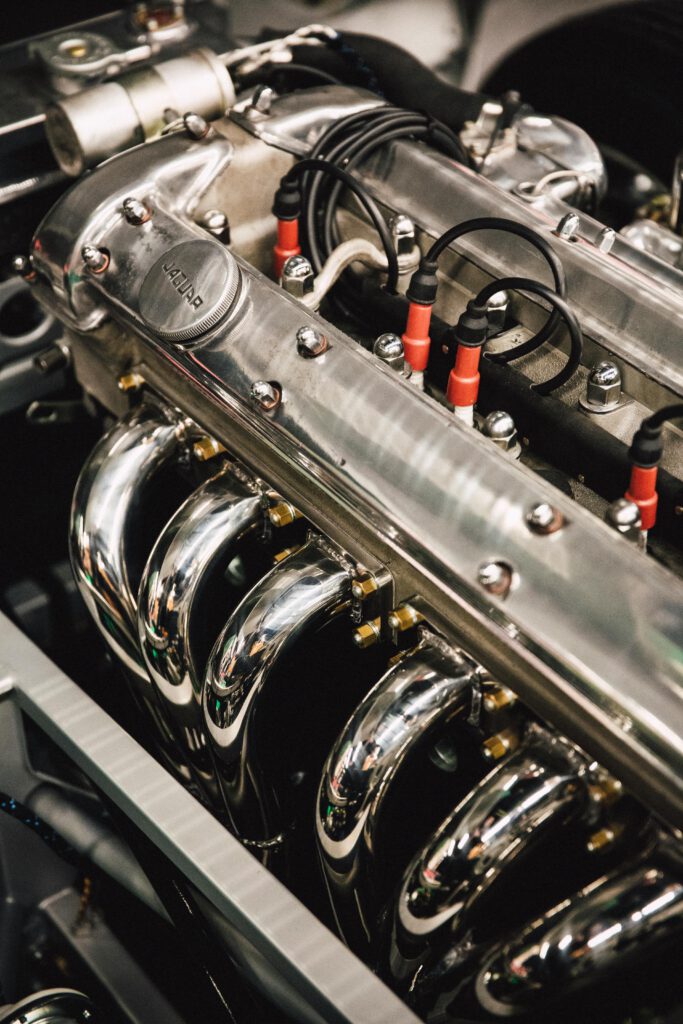 pexels-photo-2027045-2027045 Detailed view of a polished chrome engine, showcasing luxury automotive design.